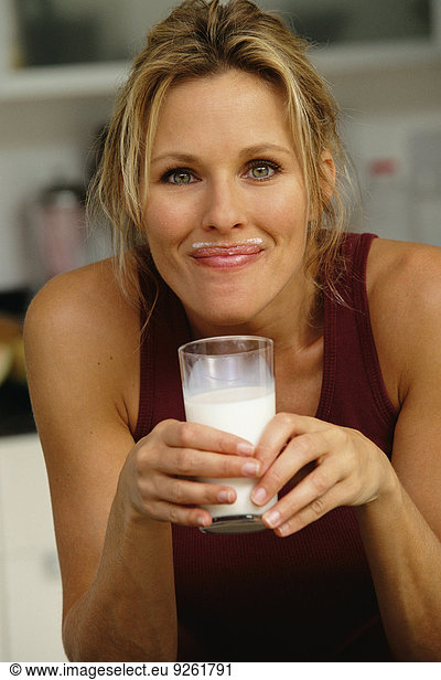 Woman smiling with milk mustache