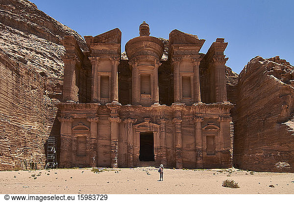 Woman standing in front of the Ad Deir in Petra  Jordan