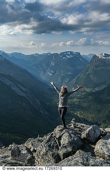 Woman standing on Dalsnibba View point  Geirangerfjord  Sunmore  Norway  Europe