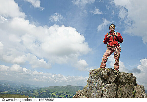 woman standing on mountain top in south Wales / UK