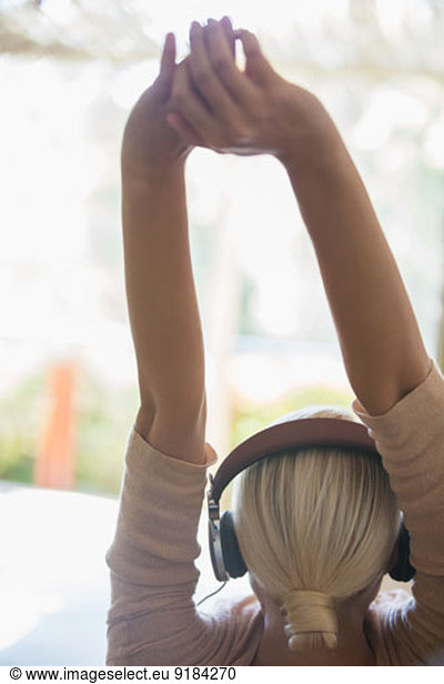 Woman stretching in headphones