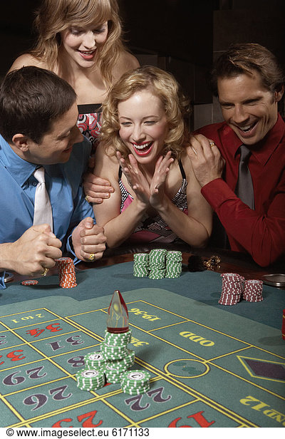 Woman successfully gambling in a casino