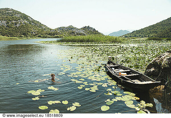 Woman swimming in Lake Skadar