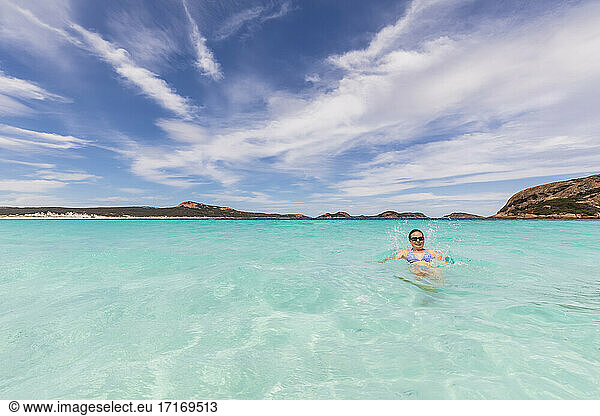 Woman swimming in turquoise water  Western Australia