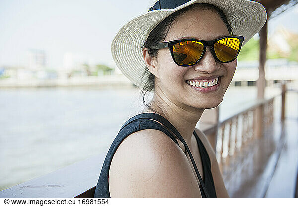 Woman taking a river cruise on Bangkok's Chao Phraya river