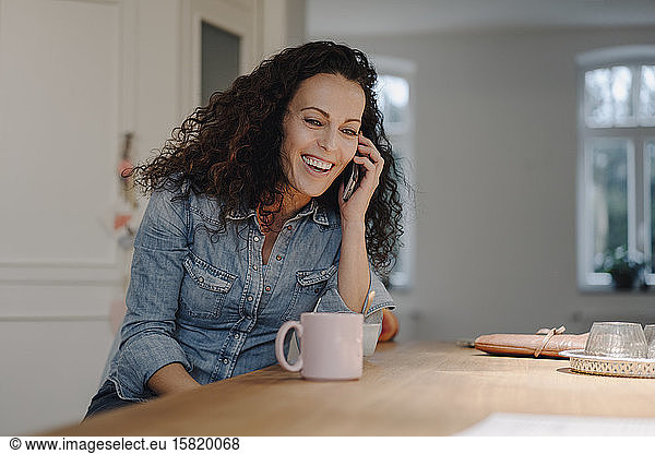 Woman talking on the phone at home