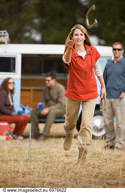 Woman Tossing Horseshoes While on a Camping Trip  Bend  Oregon  USA