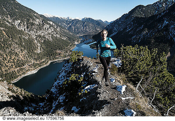 Woman trail running at Tauern  Ammergau Alps  Reutte  Tyrol  Austria
