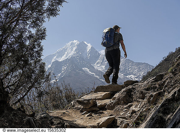 Woman trekking in the Himalayas near Namche Bazaar  Solo Khumbu  Nepal