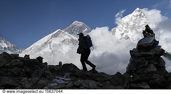 Woman trekking with Kala Patthar in background  Himalayas  Solo Khumbu  Nepal