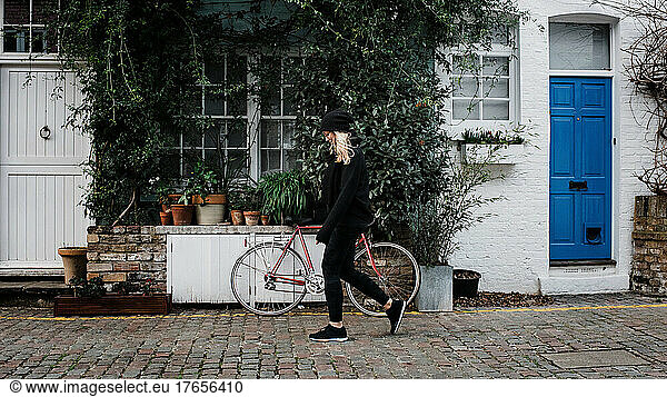 woman walking along charming London Notting Hill street