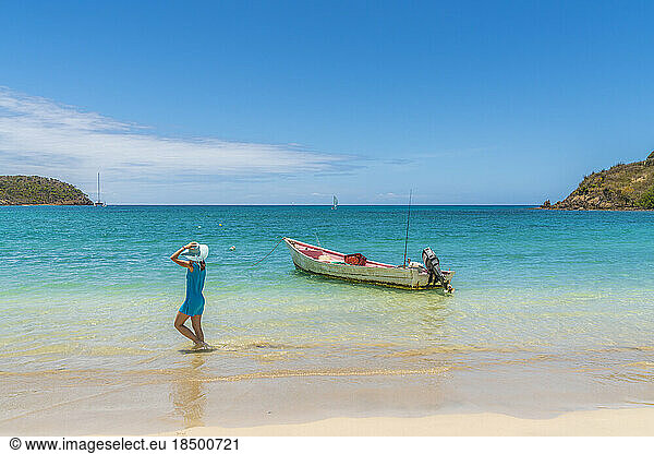 Woman walking on seaside  Caribbean Sea  Antilles
