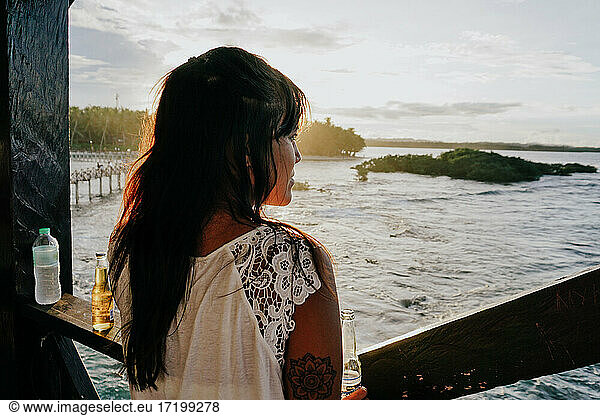 Woman watching the sunset on Siargao Island  Philippines