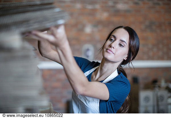 Woman wearing apron working