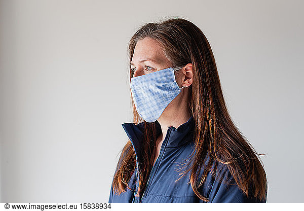 Woman wearing homemade cloth face mask during Covid 19 pandemic.