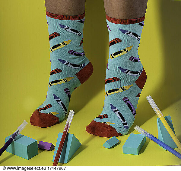 Woman wearing multicolored stylish socks with pencil pattern