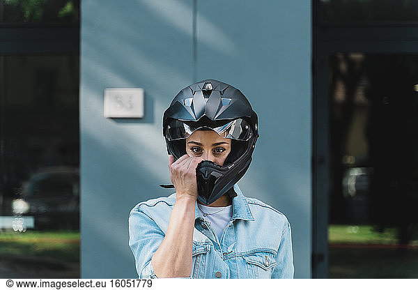 Woman with black motorcycle helmet