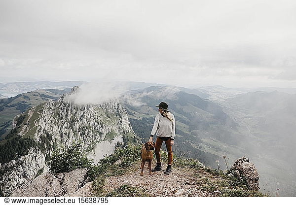 Woman with dog on viewpoint  Grosser Mythen  Switzerland