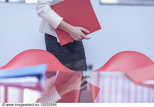 Woman with folders in an office