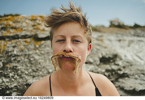 Woman with moustache out of bread crust