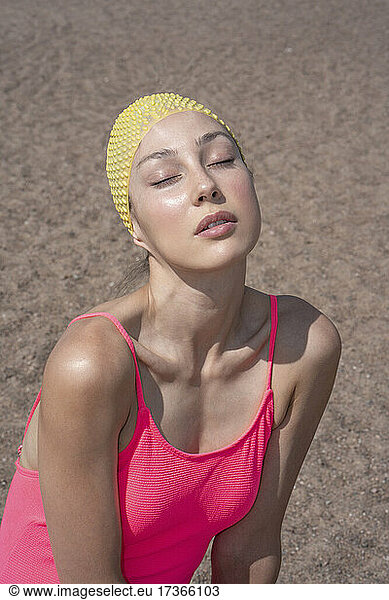 Woman with pink swimwear sunbathing