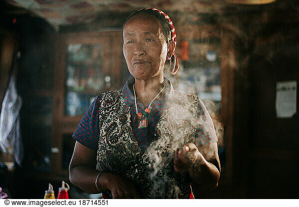 Woman with sage greeting in the early morning