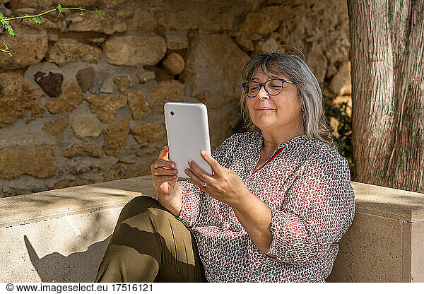 woman with tablet in the park