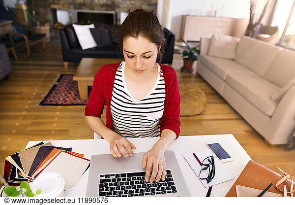 Woman working at desk at home