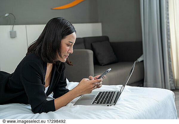 Woman working in hotel room Business woman in suit working