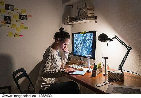 Woman working late at home