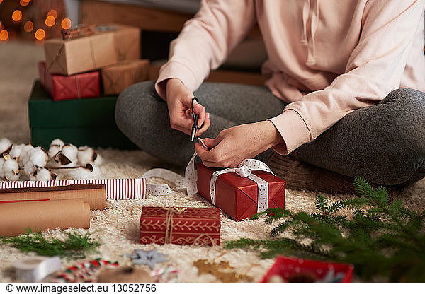 Woman wrapping Christmas presents