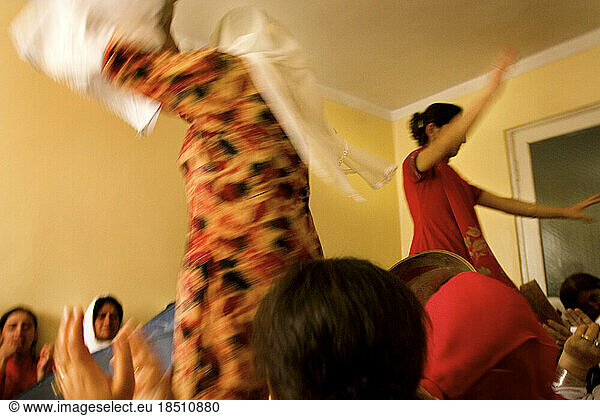 Women dance at a wedding party in Kabul.