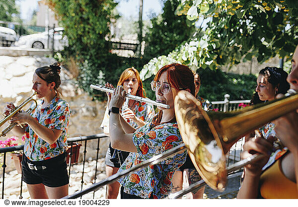 Women doing rehearsel with wind instruments