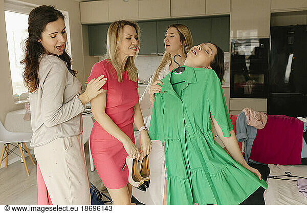 Women getting dressed for party at home