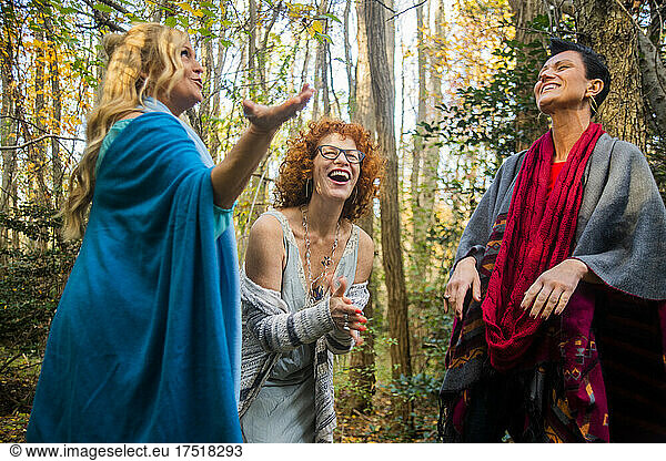 Women laughing in the woods