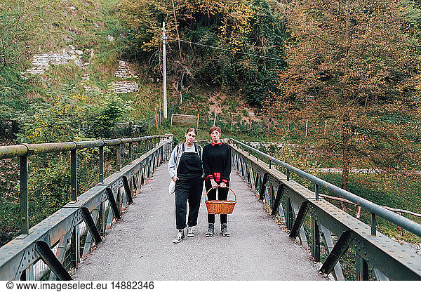 Women on bridge  Rezzago  Lombardy  Italy