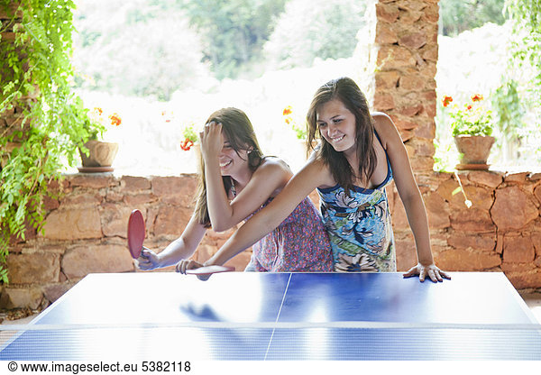 Women playing table tennis