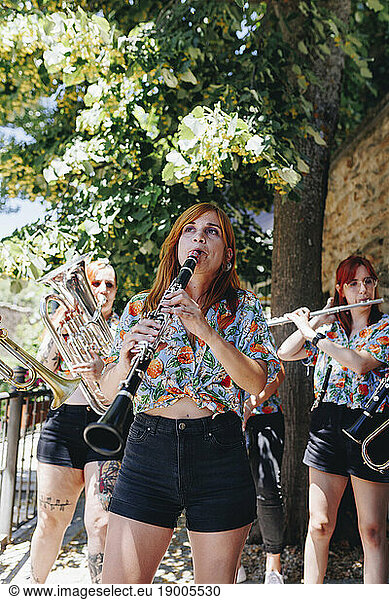Women's folk group doing rehearsel with wind instruments