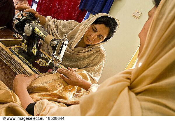 Women sew in a Kabul workroom.