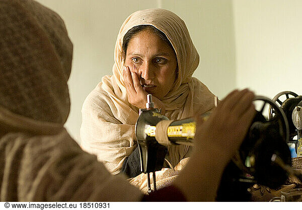 Women sew in a Kabul workroom.
