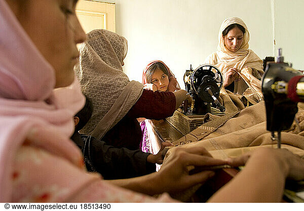 Women sew in a Kabul workroom.