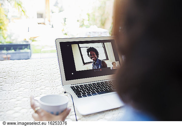 Women video conferencing on laptop screen