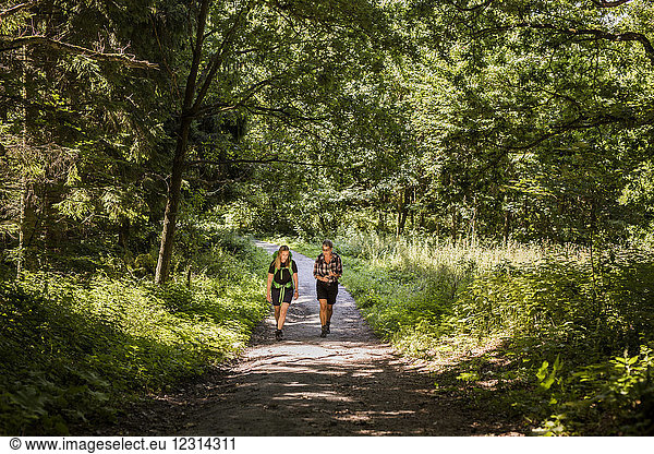 Women walking in forest