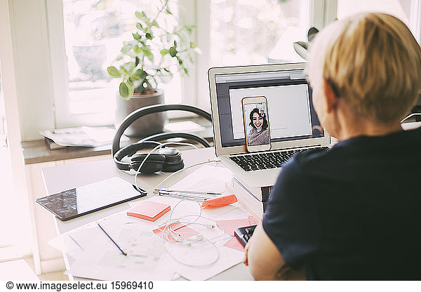 Women workin in office at home having an online meeting