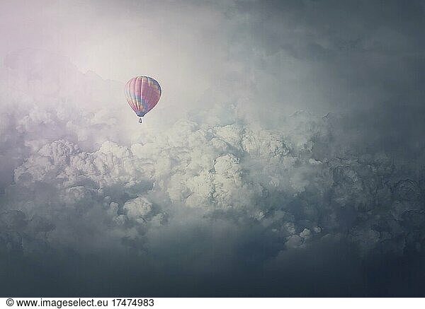 Wonderful adventure  epic scene with a hot air balloon flying over the clouds. Fabulous minimalist view  airship floating in the sky. Travel and journey concept. Inspirational cloudscape scenery