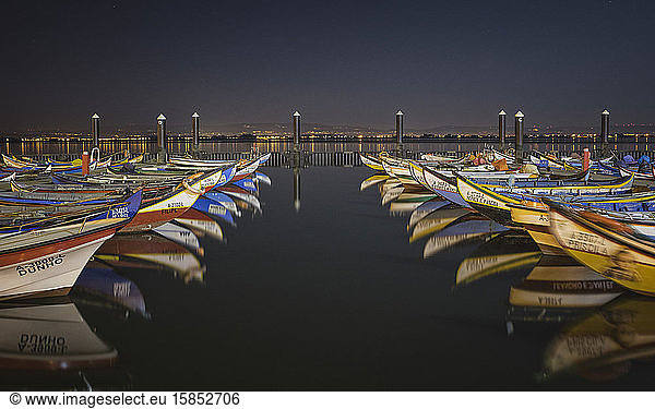 wooden boats reflected in the Aveiro's port