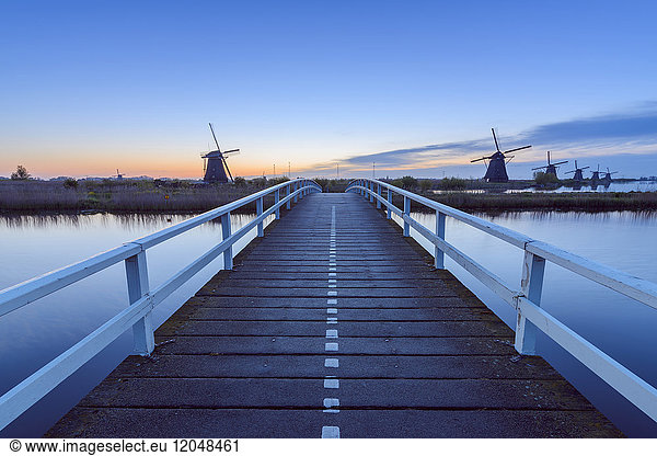 Wooden Bridge with Windmills at Dawn  Kinderdijk  South Holland  Netherlands