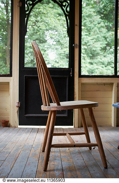 Wooden chair on wooden floorboards