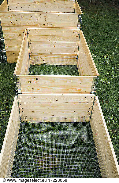 Wooden crates on grass at garden