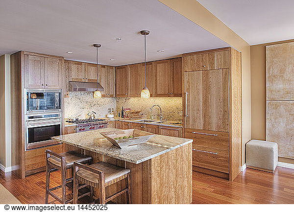 Wooden cupboards in luxury kitchen